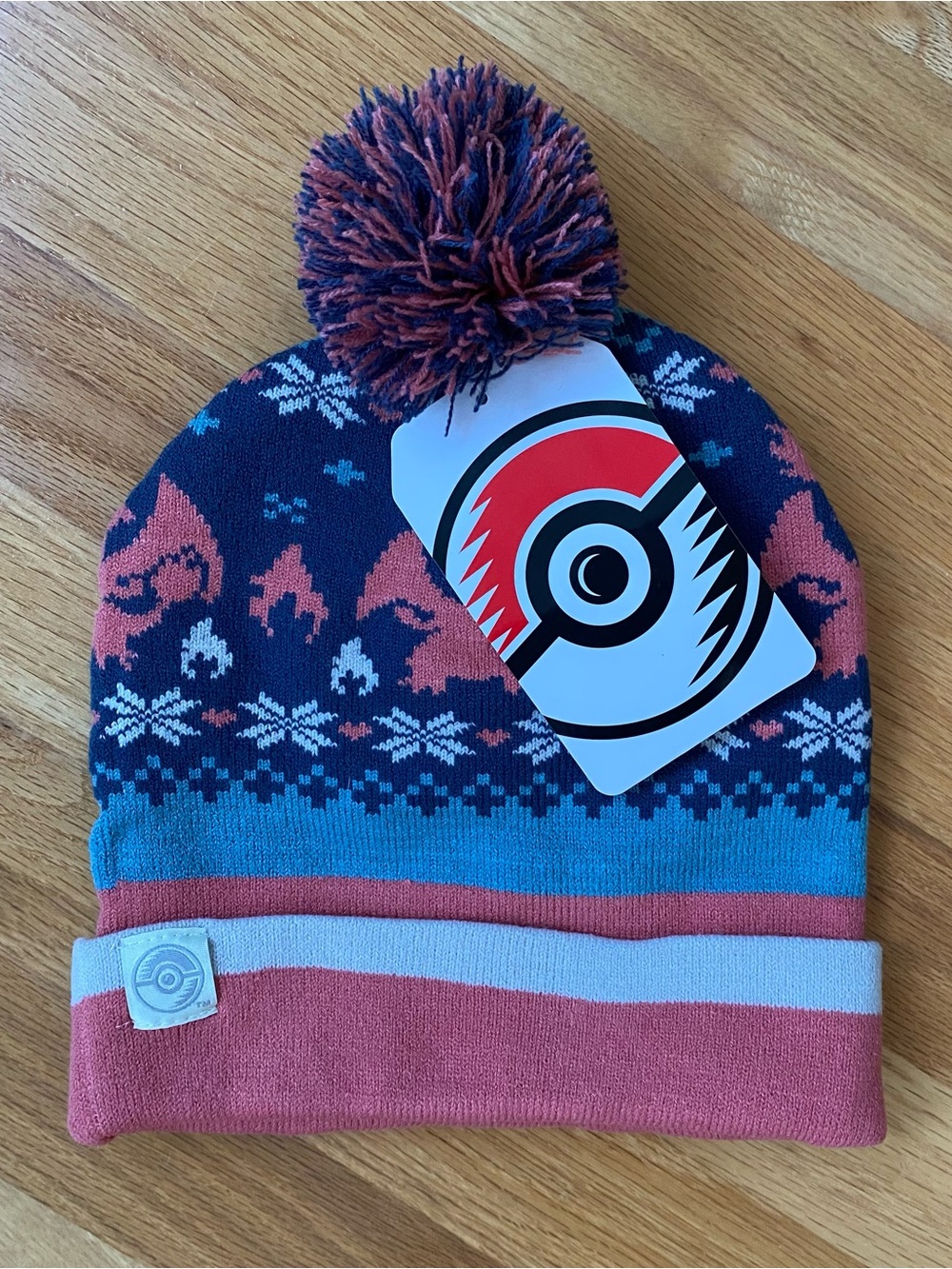 Pokemon Charizard Festive Winter Pom Pom Beanie Hat in Blue, Coral & Light Blue